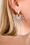 Y'all?! These White Marble Sunburst Earrings **Chefs Kiss** are the BEST. We are in love with the white marble with the brushed gold and how boho glam they are. Pair it with our Bare With Me Sweater + Classic Booties for an awesome date night look. 
